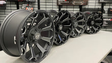 Load image into Gallery viewer, 15&quot; GTW Raven Matte Black Wheels with 23&quot; GTW Nomad All-Terrain Tires (Set of 4)